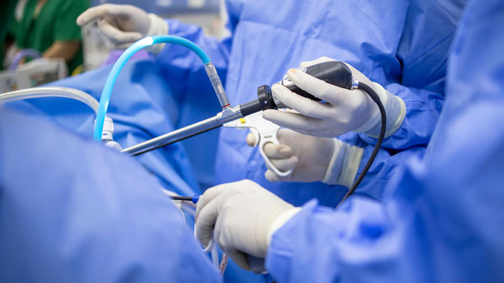 Surgeon performing an arthroscopy.